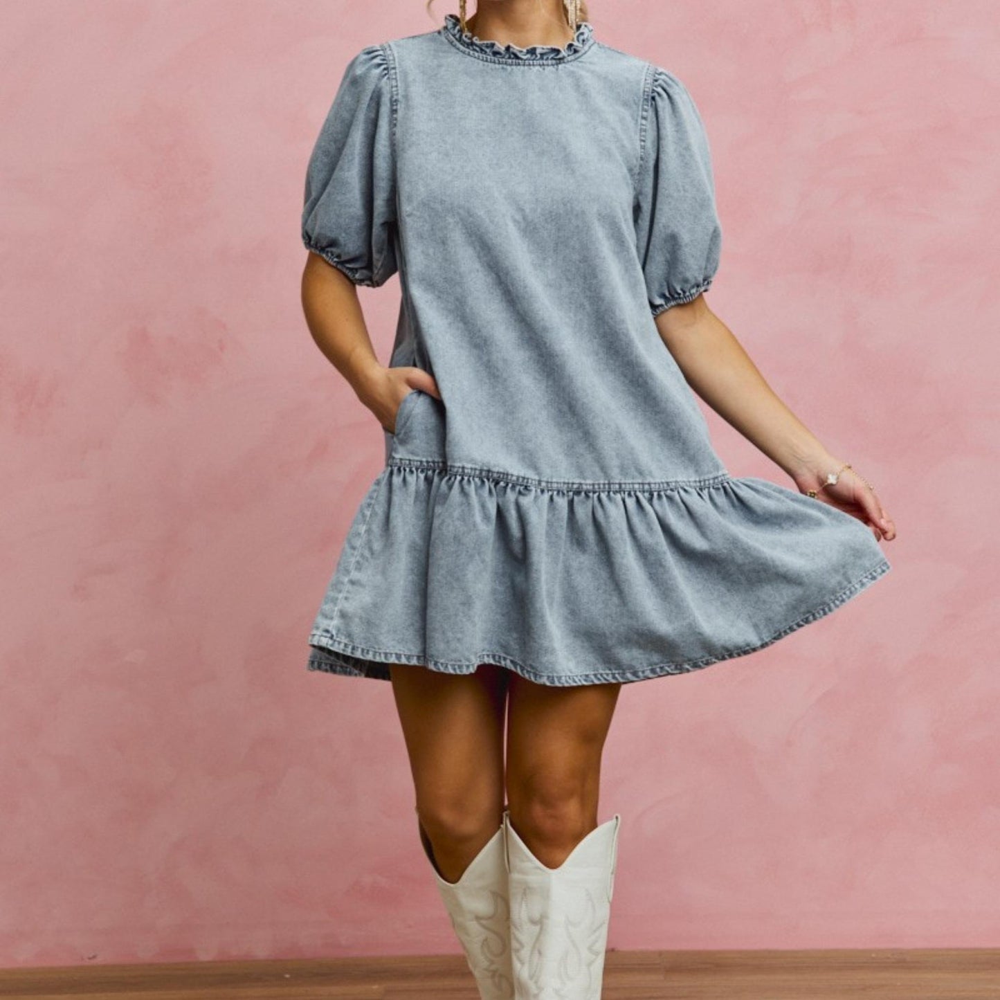SO ME denim puff sleeve mini dress styled with white knee-high boots.