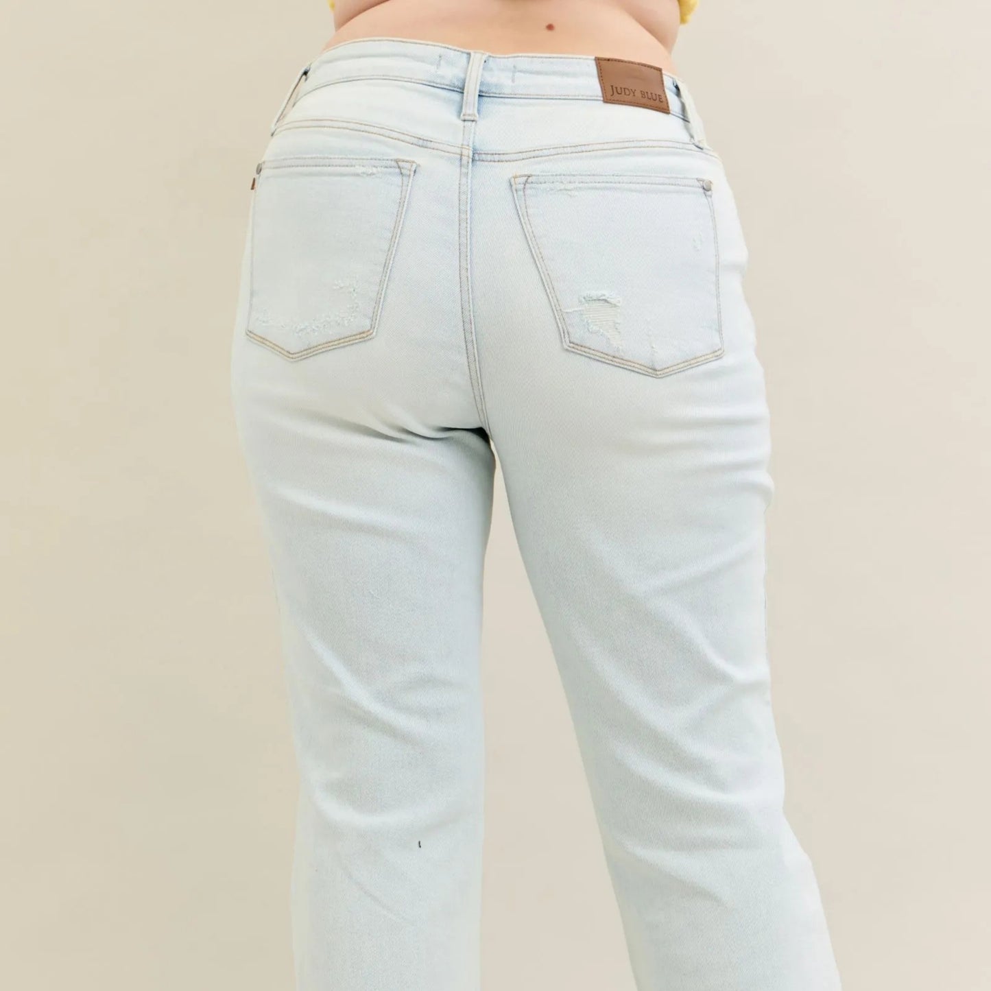 Back view of the Judy Blue destroy and fray hem bootcut jeans.