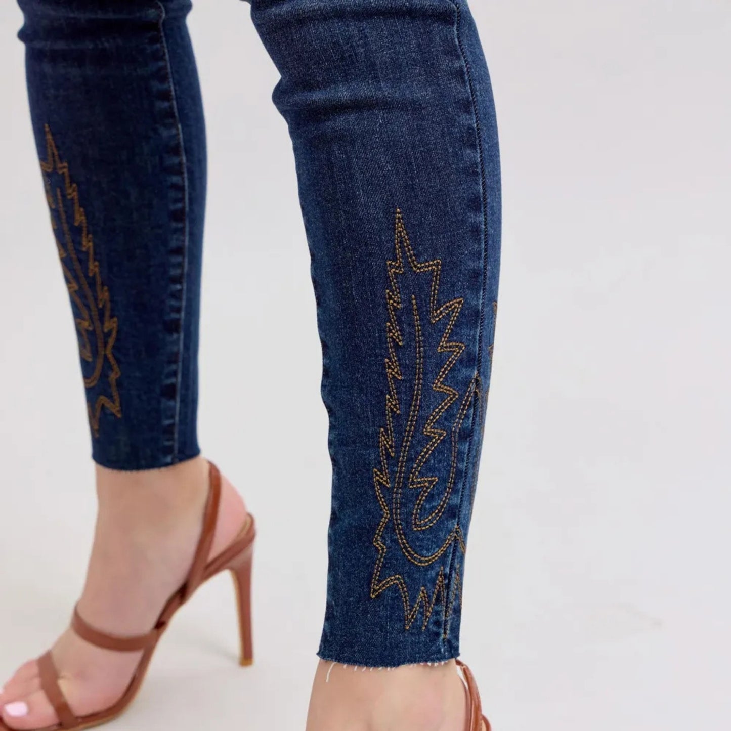 Model view of the high-waist embroidered skinny jeans.