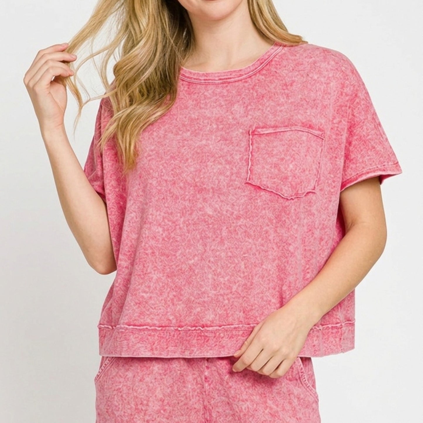 Lifestyle view of the red boxy top and shorts set showing the relaxed boutique fit.
