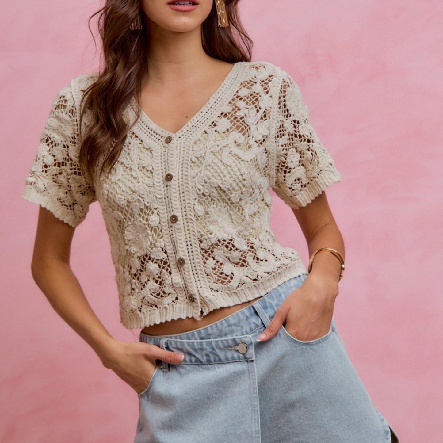 Lifestyle view of the SO ME floral crochet lace cardigan layered over a camisole for a bohemian summer look.