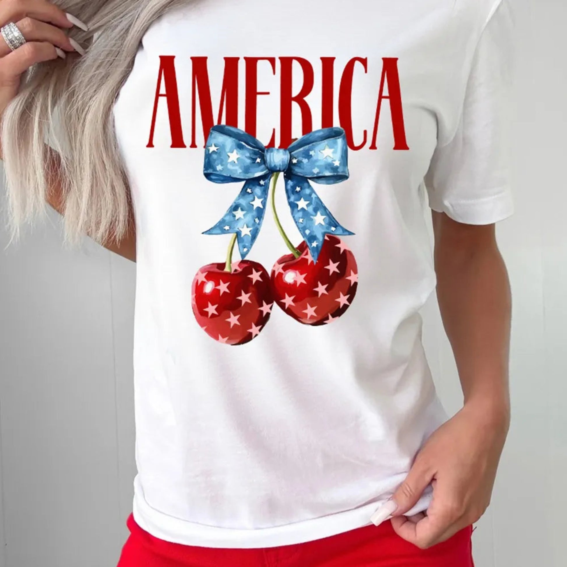 AMERICA Bow Cherry Crewneck T-Shirt in White - Lifestyle View 2