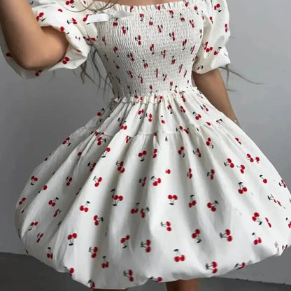 Puff Sleeve Cherry Print Smocked Mini Dress in White - Lifestyle View 2