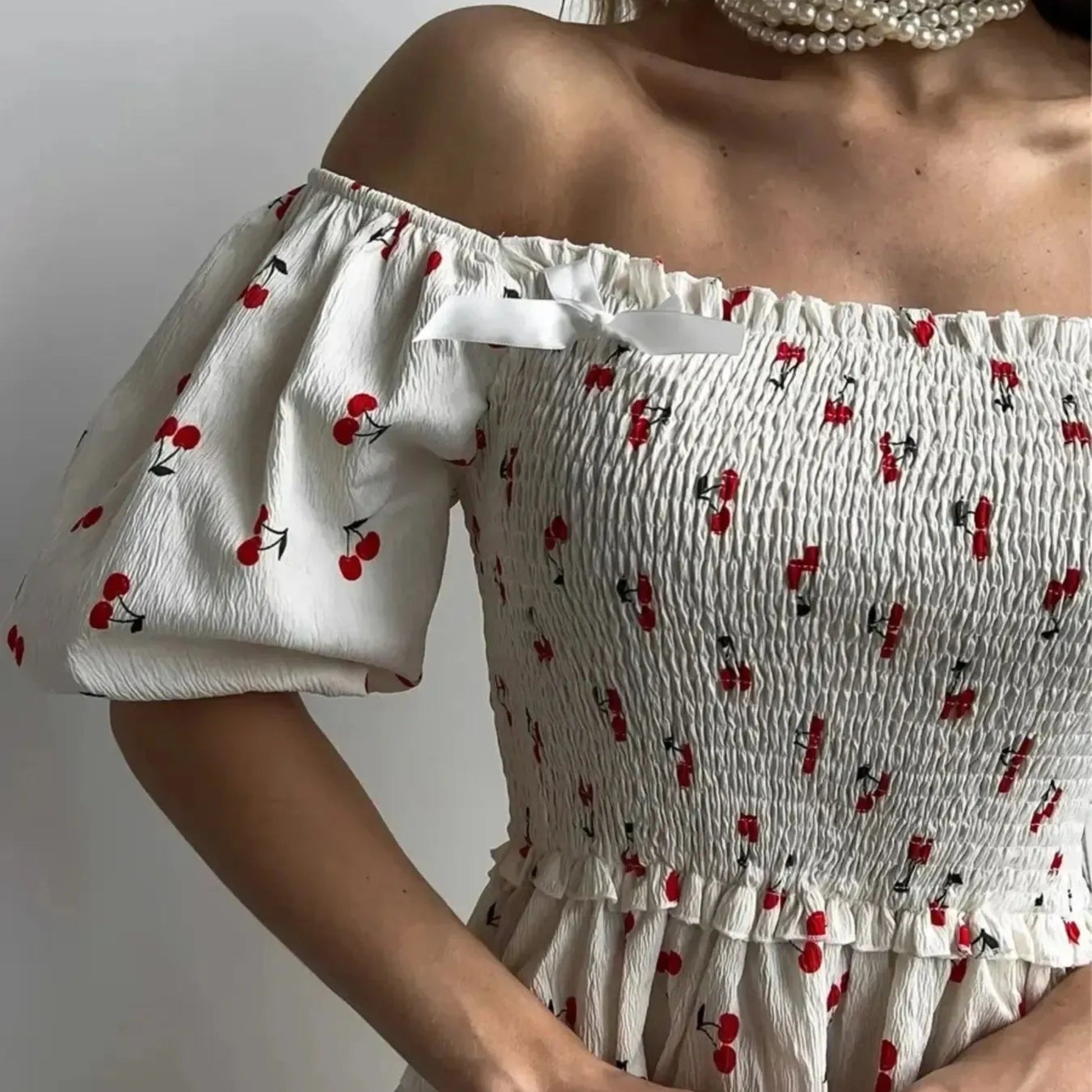 Puff Sleeve Cherry Print Smocked Mini Dress in White - Detail View