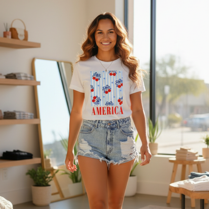 Woman wearing a t-shirt with 'America' and red, white, and blue design in a bright room.