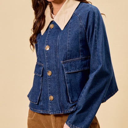 Woman wearing a blue denim jacket with a cream collar and beige hat on a beige background