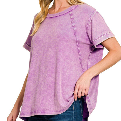 Woman wearing a purple acid wash t-shirt on a white background