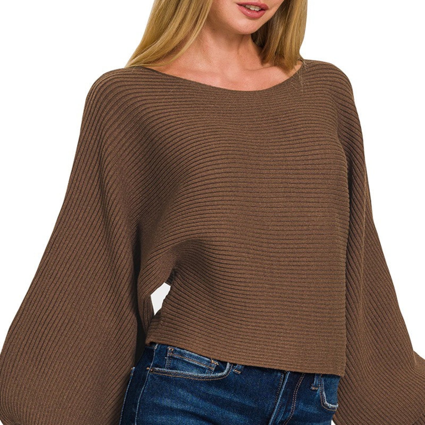 Brown ribbed sweater worn by a person on a white background