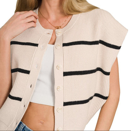 Woman wearing a sand beige cardigan with black stripes on a white background