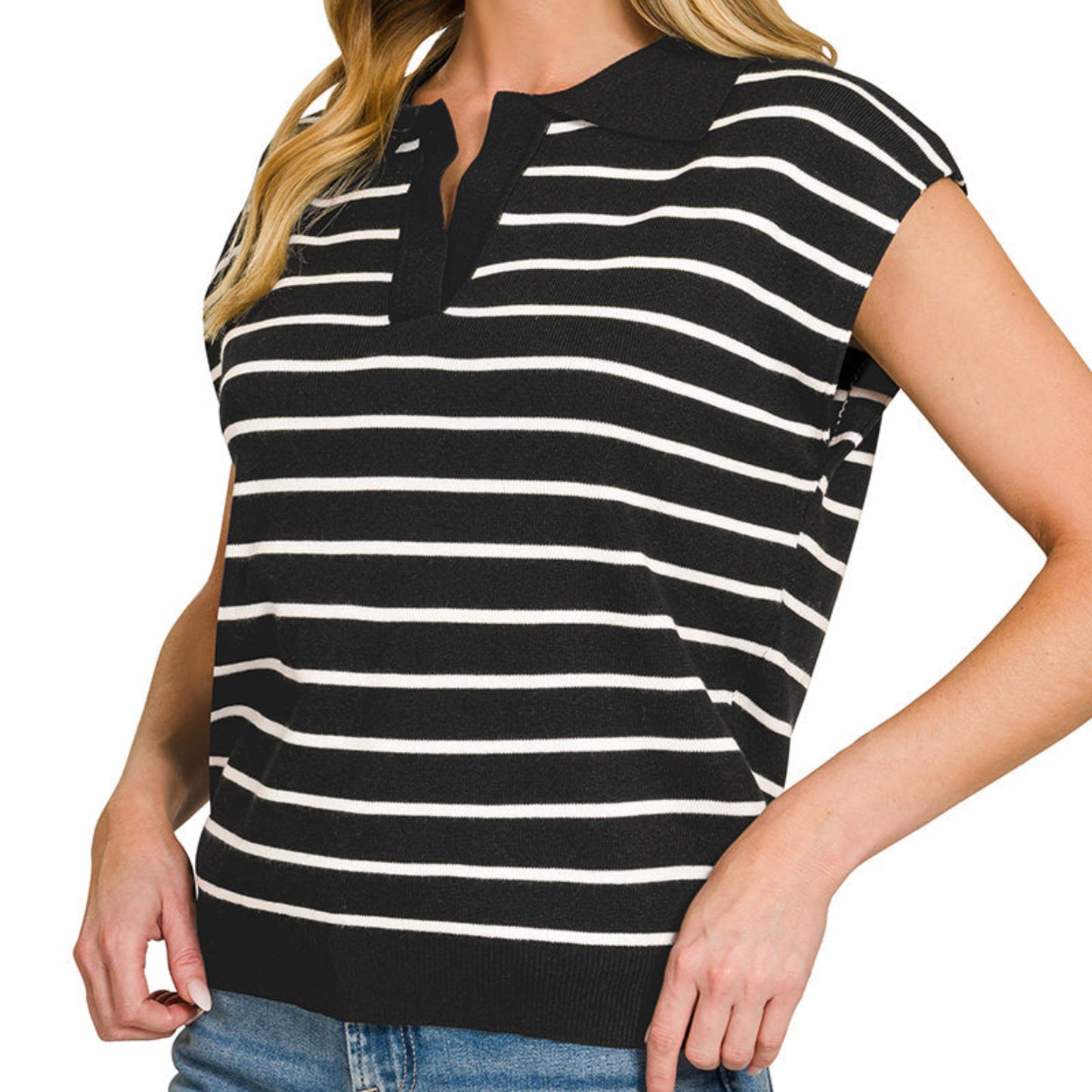 Woman wearing a black and white striped shirt with a plain background