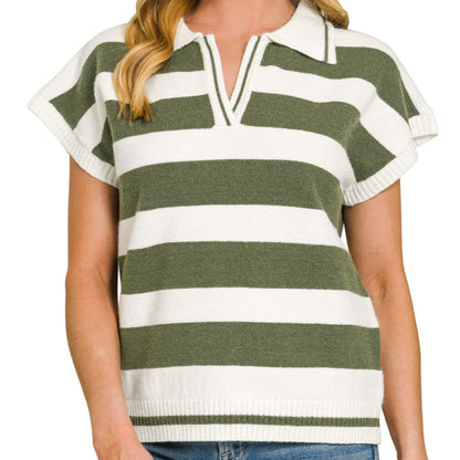 Woman wearing a green and white striped sweater with ruffled sleeves on a white background