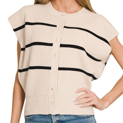 Woman wearing a sand beige cardigan with black stripes on a white background