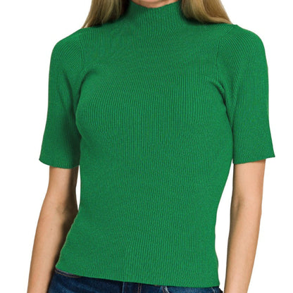 Woman wearing a green ribbed turtleneck sweater on a white background