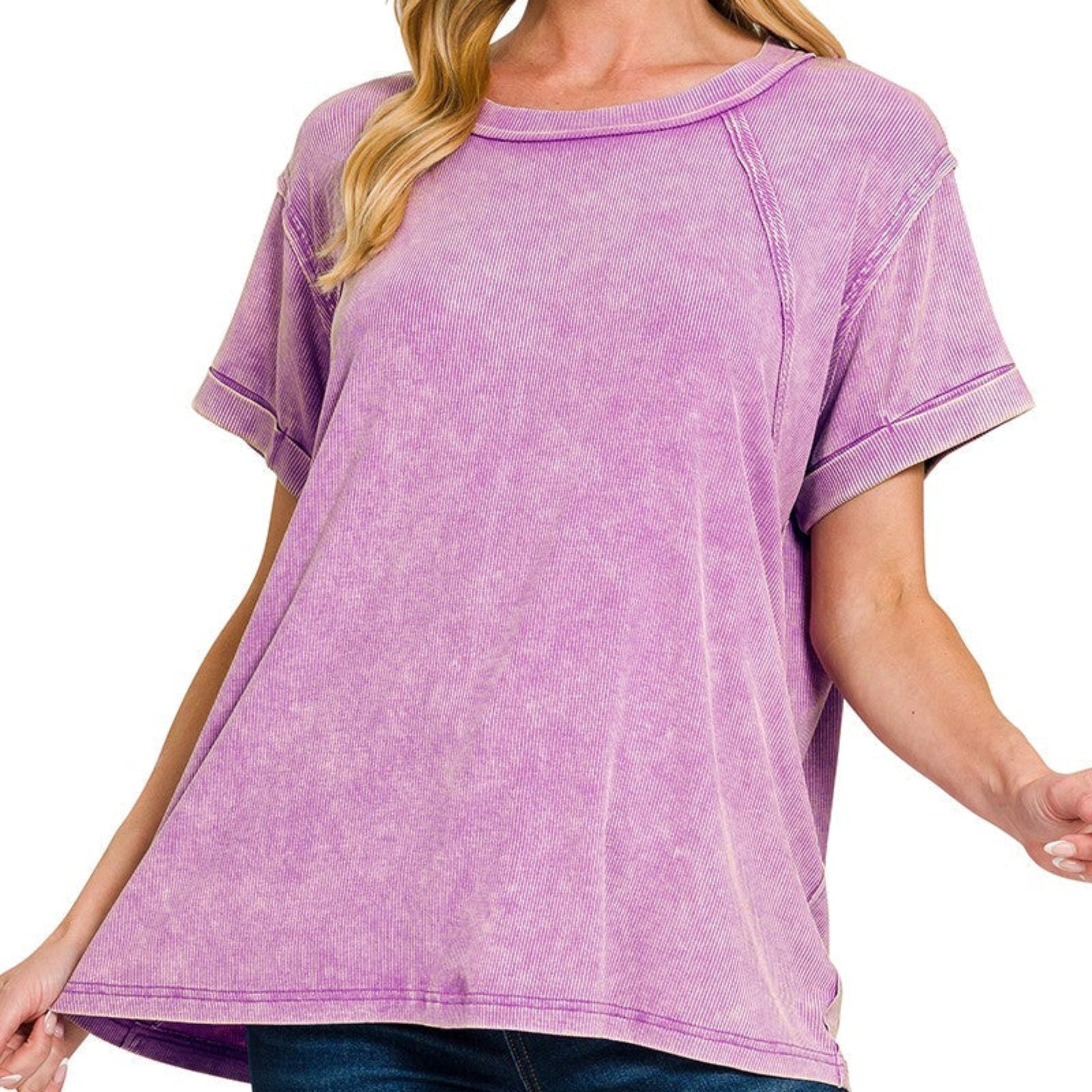 Woman wearing a purple t-shirt with a white background