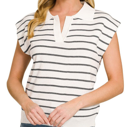 Woman wearing a striped shirt with a plain background