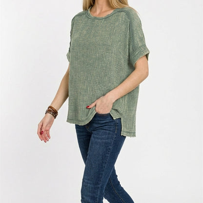 Lifestyle shot of the acid-washed double gauze tee styled for a casual outing.