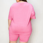 Oversized  Person wearing a pink outfit with a plain background
