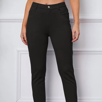 Black pants worn by a person on a white background