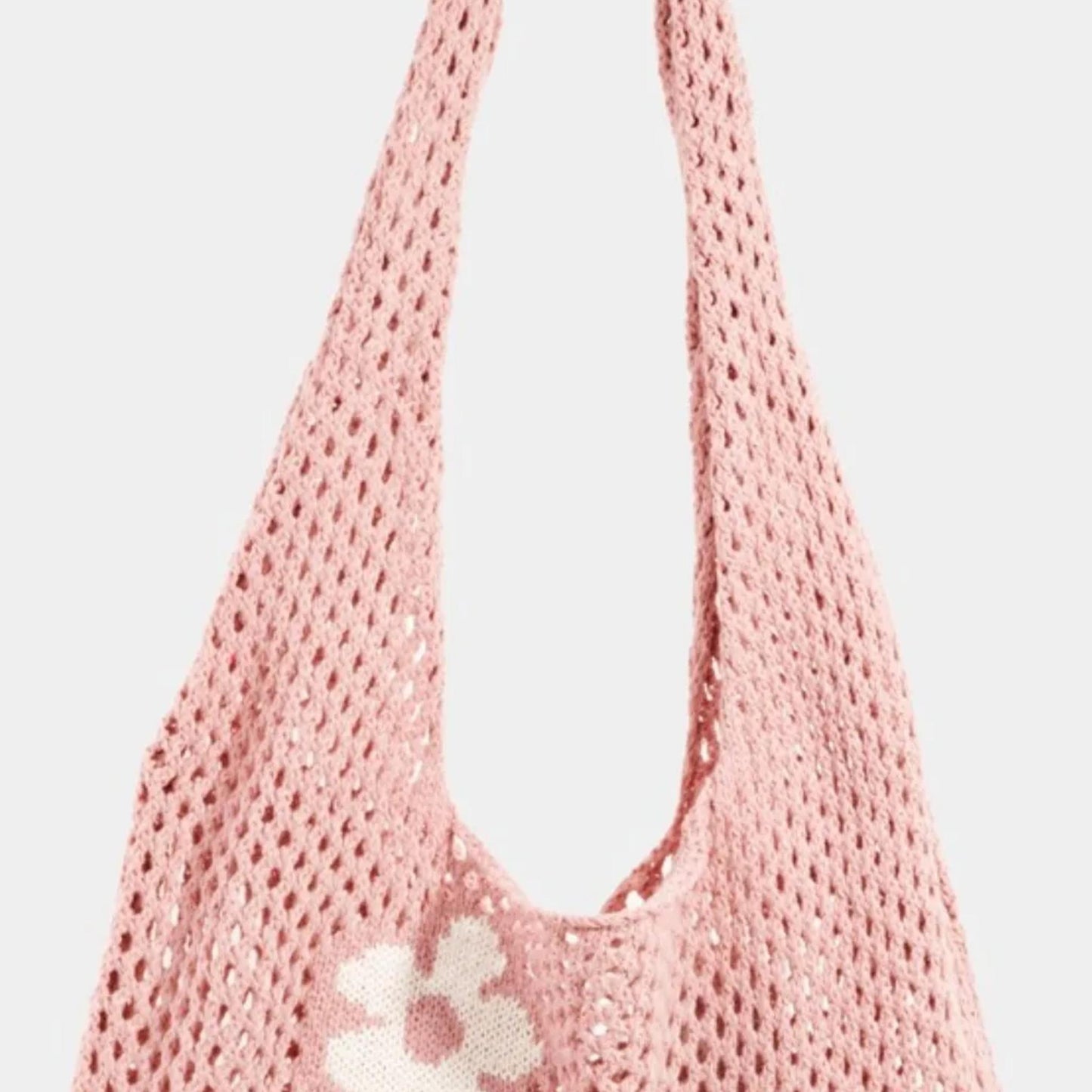 Close-up of the open crochet mesh design and floral details on the Fame Flower hobo bag.