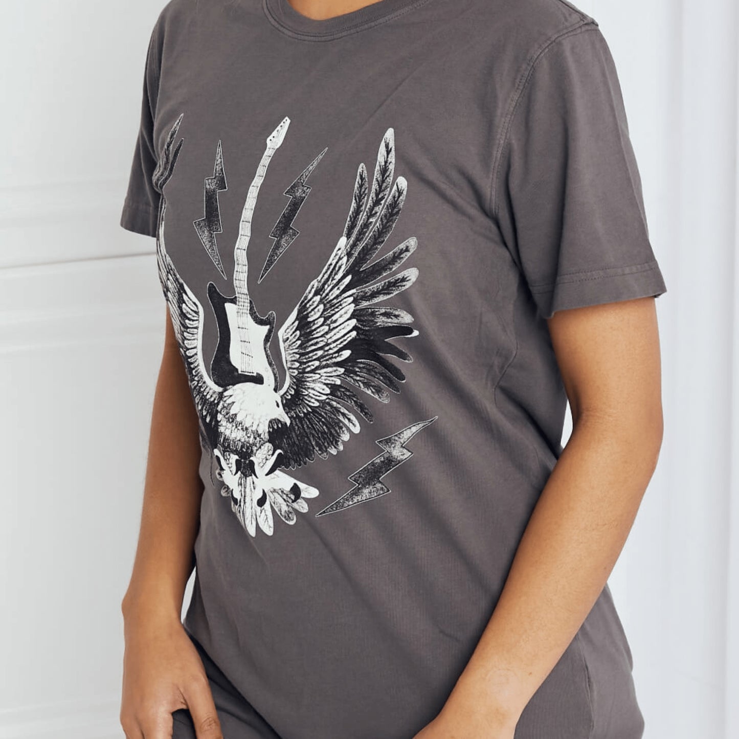Lateral perspective of the mineB eagle graphic shirt highlighting the regular sleeve fit.