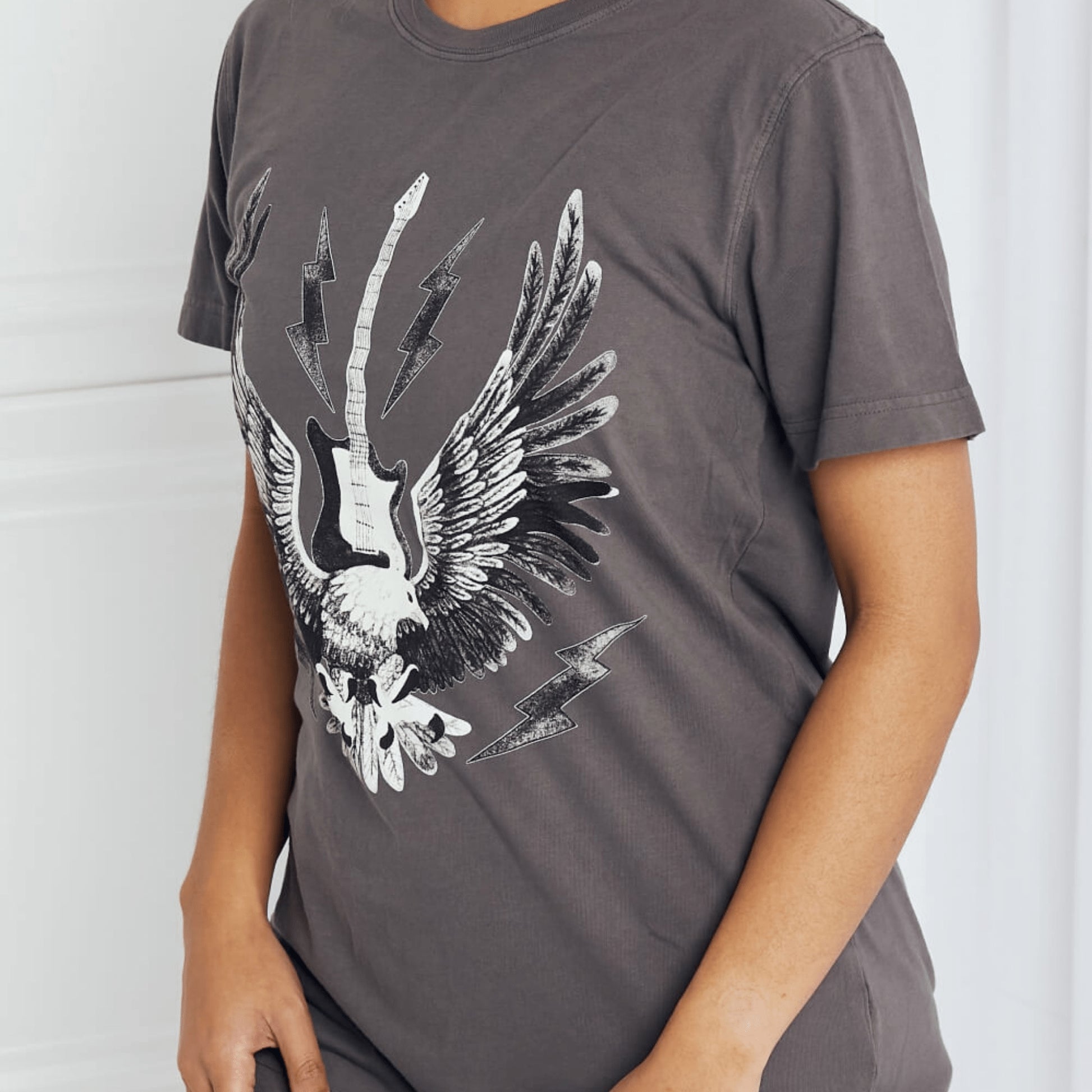 Lateral perspective of the mineB eagle graphic shirt highlighting the regular sleeve fit.