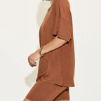Brown outfit worn by a person on a white background