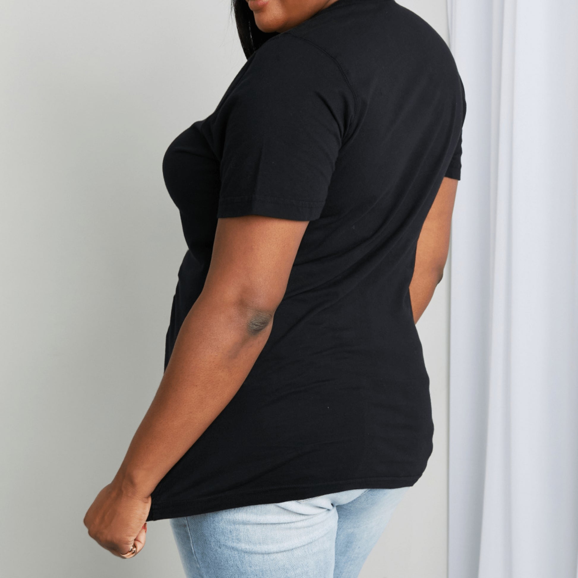 Posterior view of the mineB butterfly tee showing the relaxed fit and regular short sleeves.
