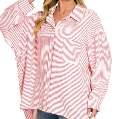 A professional boutique display of the red striped button-down shirt on a minimalist hanger.