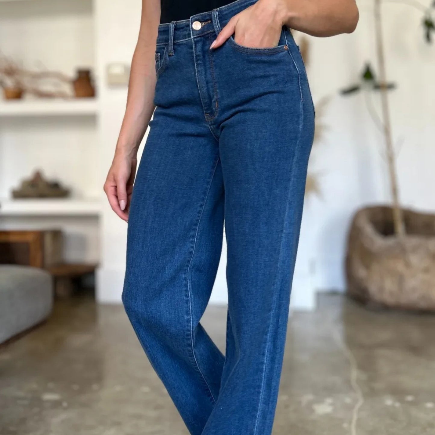 Side view showcasing the straight-leg silhouette and high-waist fit.