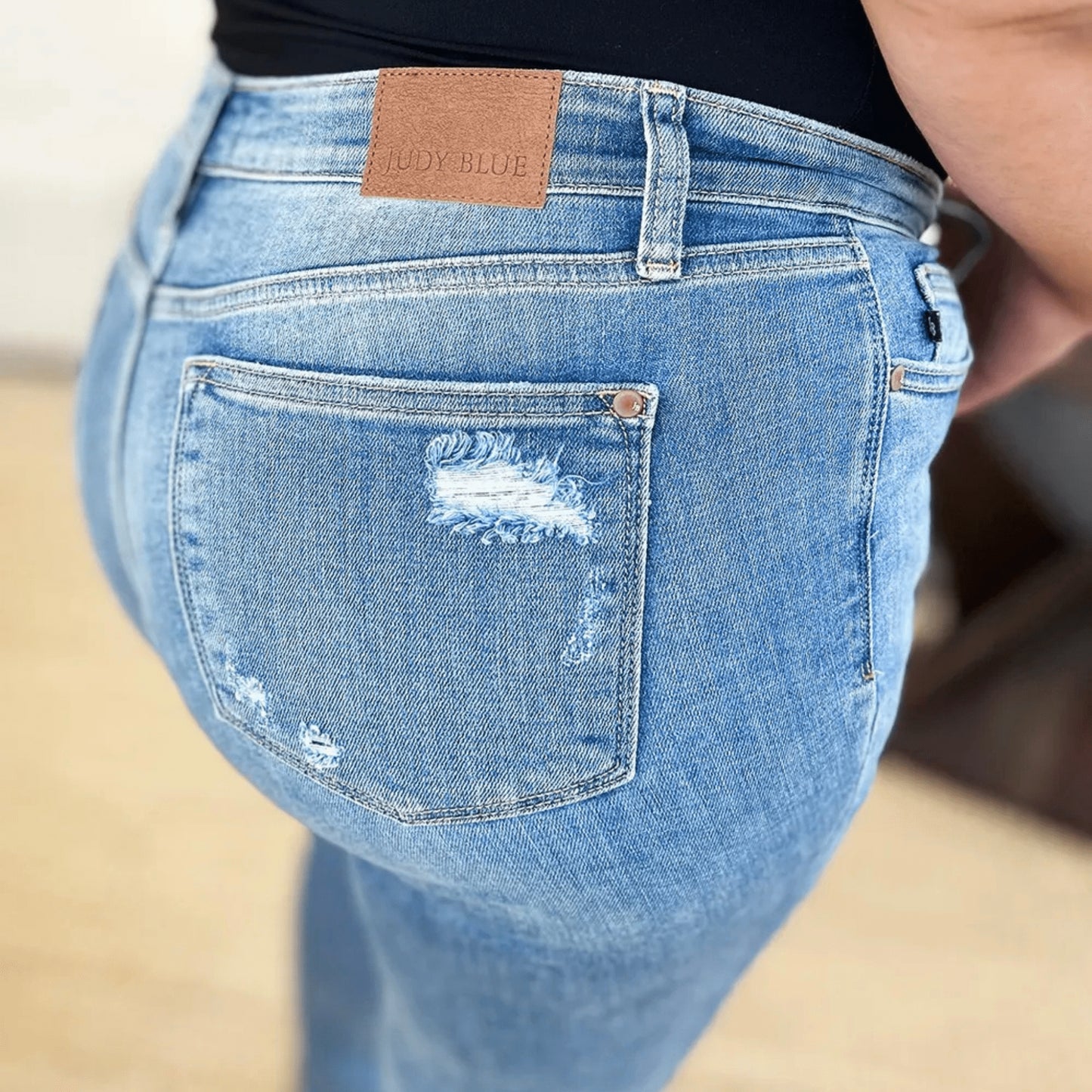 Detailed shot of the cuffed hem on Judy Blue medium wash jeans.