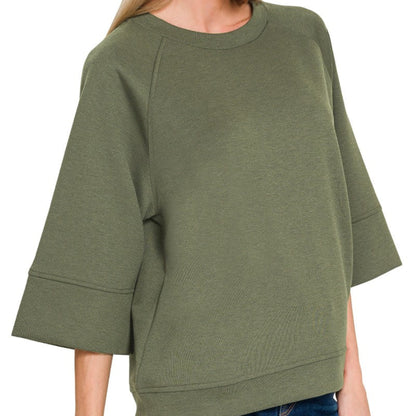 Close-up of the soft, breathable scuba material on the Dark Olive pullover.