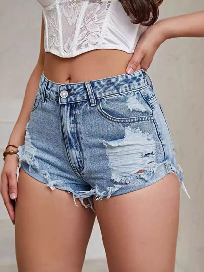 Side view of the raw hem denim shorts highlighting the relaxed leg opening and high-waist fit.