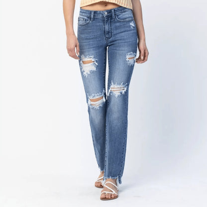 Model wearing Judy Blue distressed straight leg jeans and a yellow striped shirt.