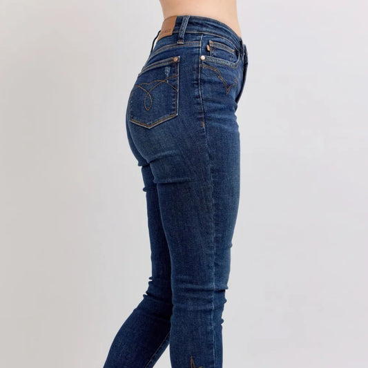 Side view showcasing the embroidery detail and skinny fit.