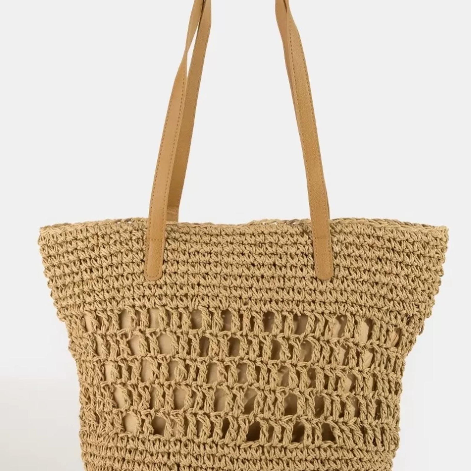 Khaki woven tote bag with brown handles on a white background