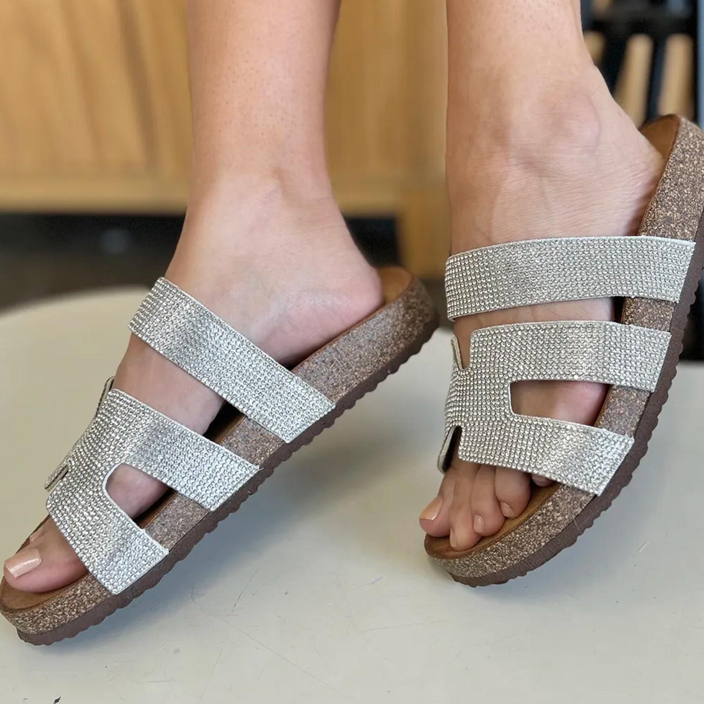 Full-length view of the Forever Link silver rhinestone sandals showcasing the elegant silhouette.