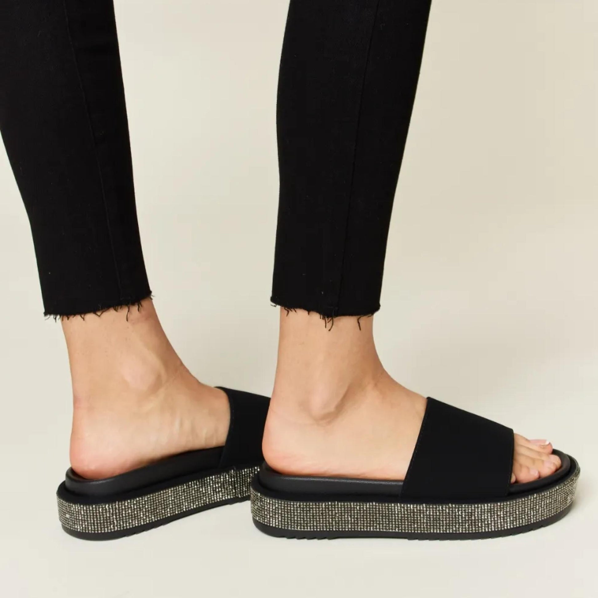 Side profile of the Forever Link silver rhinestone sandals highlighting the platform height.