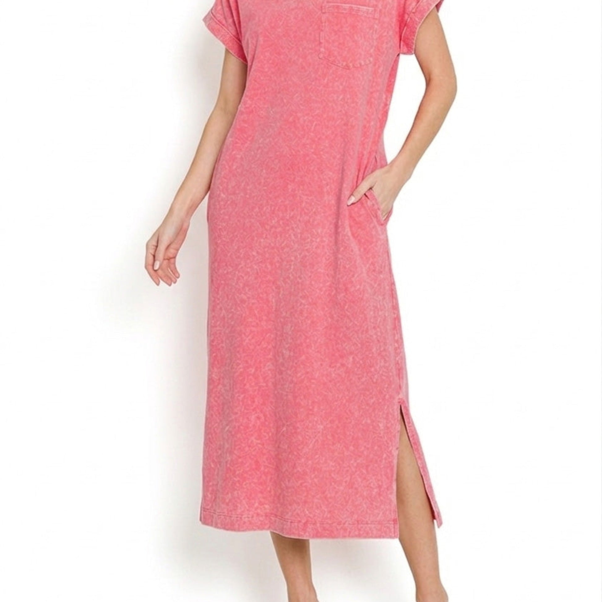 Close-up detail of the exposed seams and vintage washed cotton texture on the fuchsia dress.