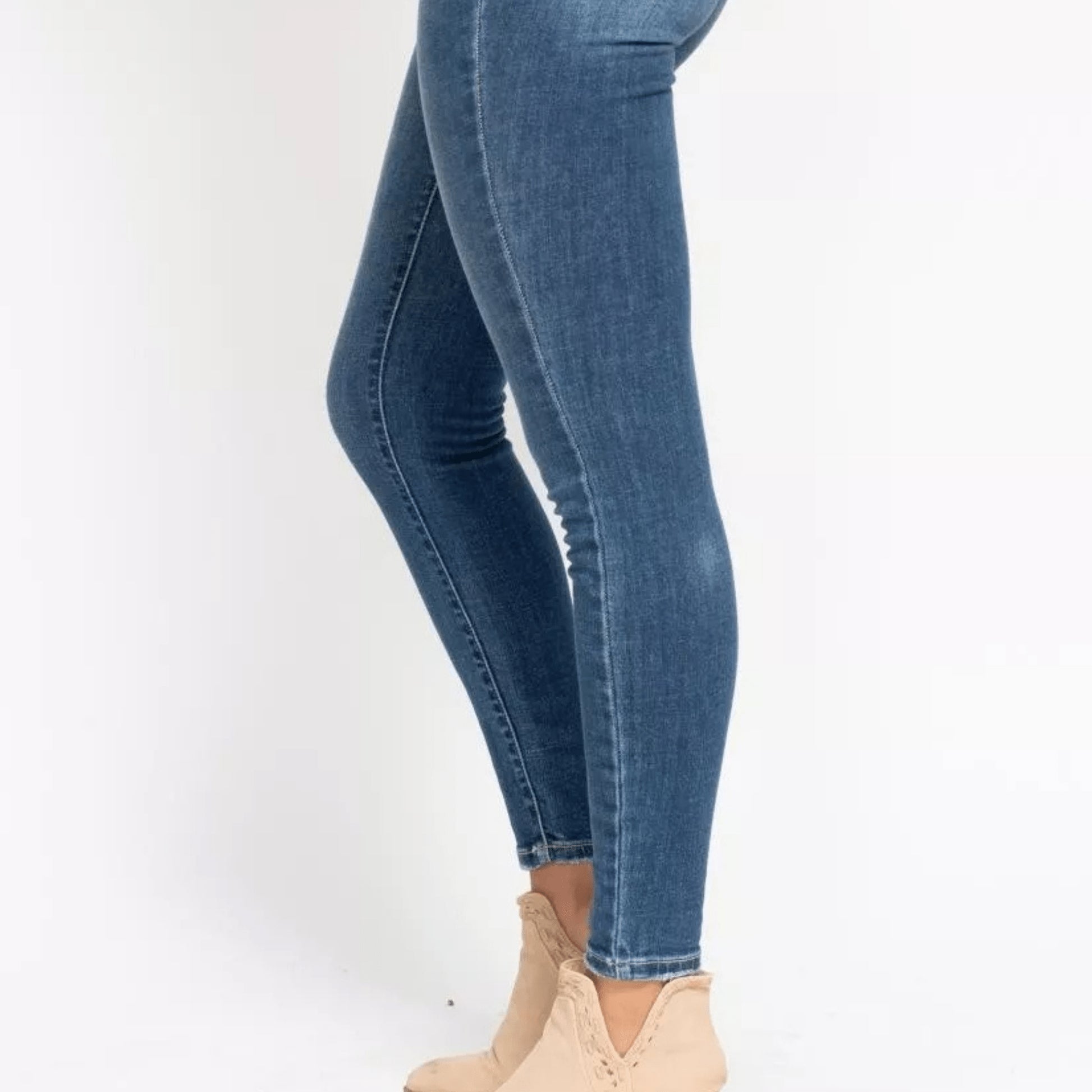 Side view of the flattering high-rise skinny fit denim.