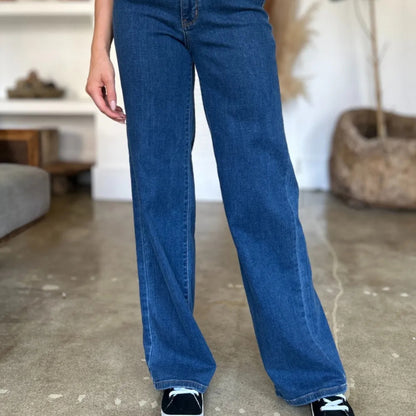 Frontal display of the medium wash straight-leg jeans.