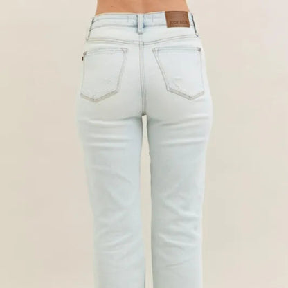 Model view of the high-waist destroyed bootcut denim.