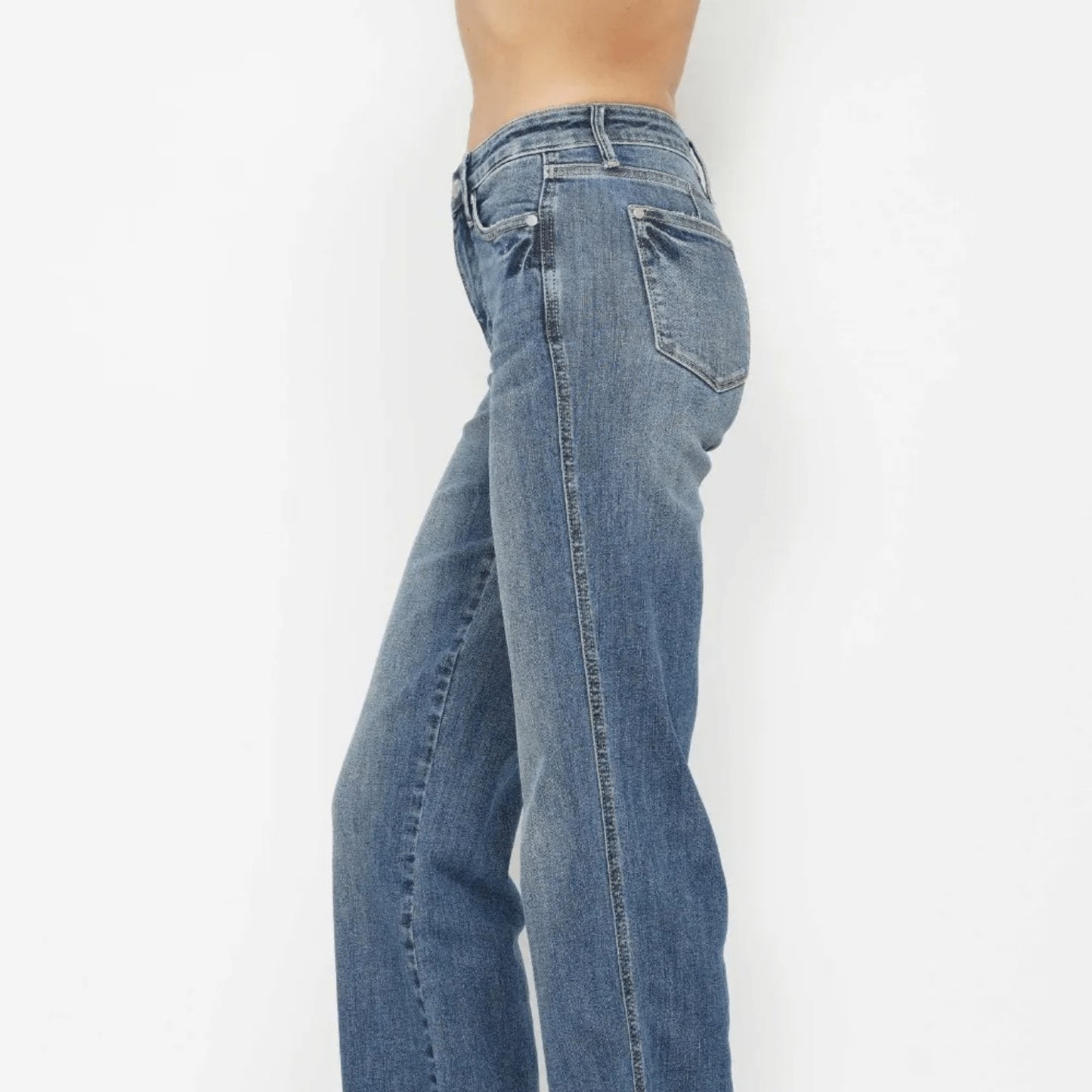 Side profile of Judy Blue straight jeans showing the smoothing tummy control panel.