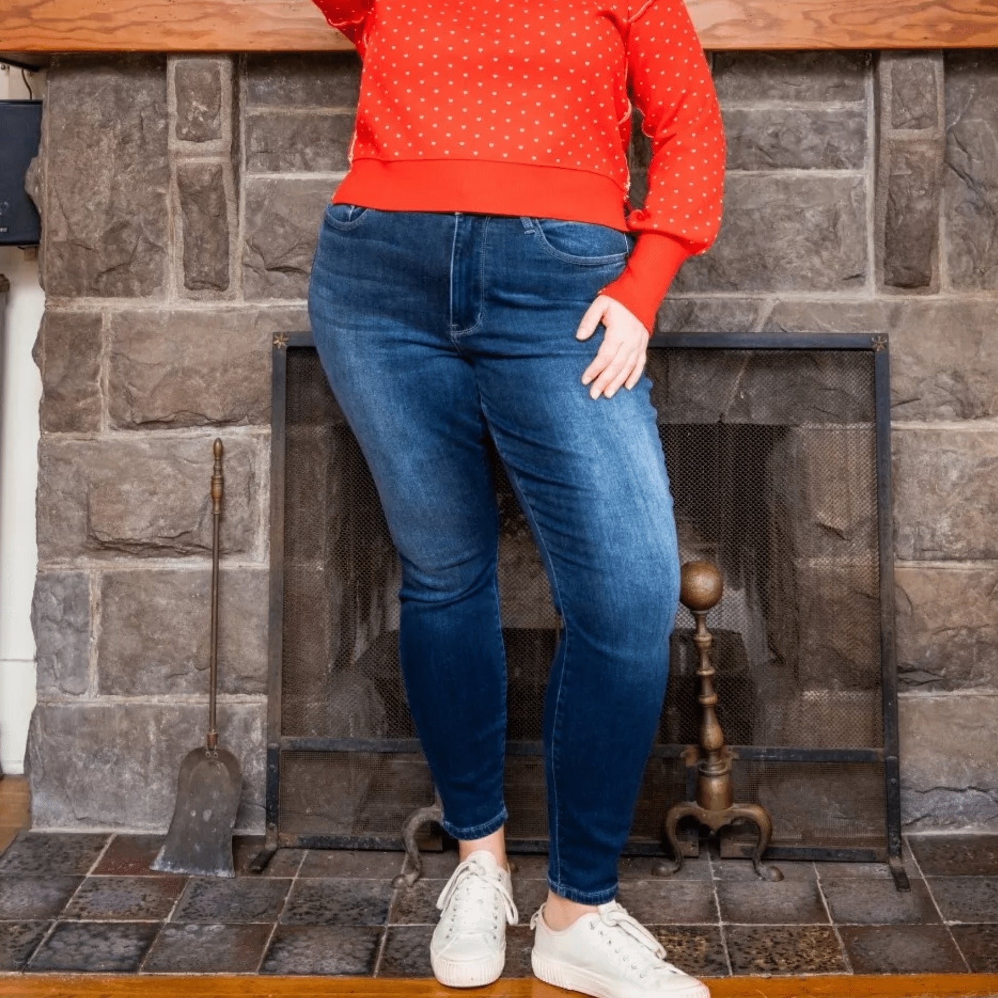 Close-up of the high-waistband on Judy Blue thermal jeans showing the secure button and zip closure.