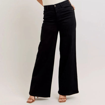 Frontal view of high-waisted black wide-leg jeans highlighting the cinched waist.
