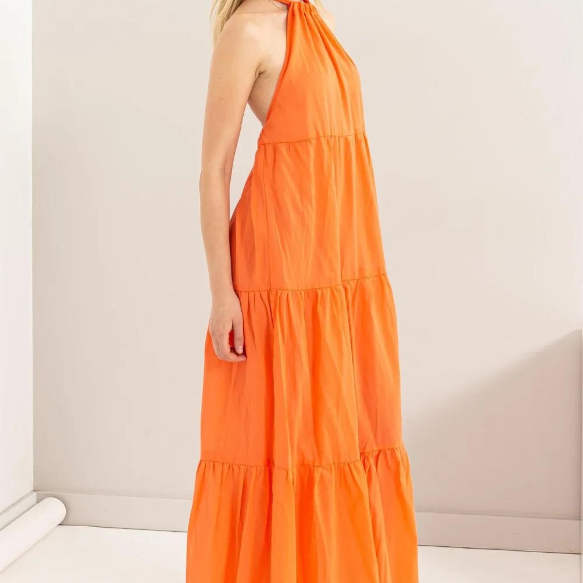 Front view of the HYFVE Orange halter neck cover up maxi dress.