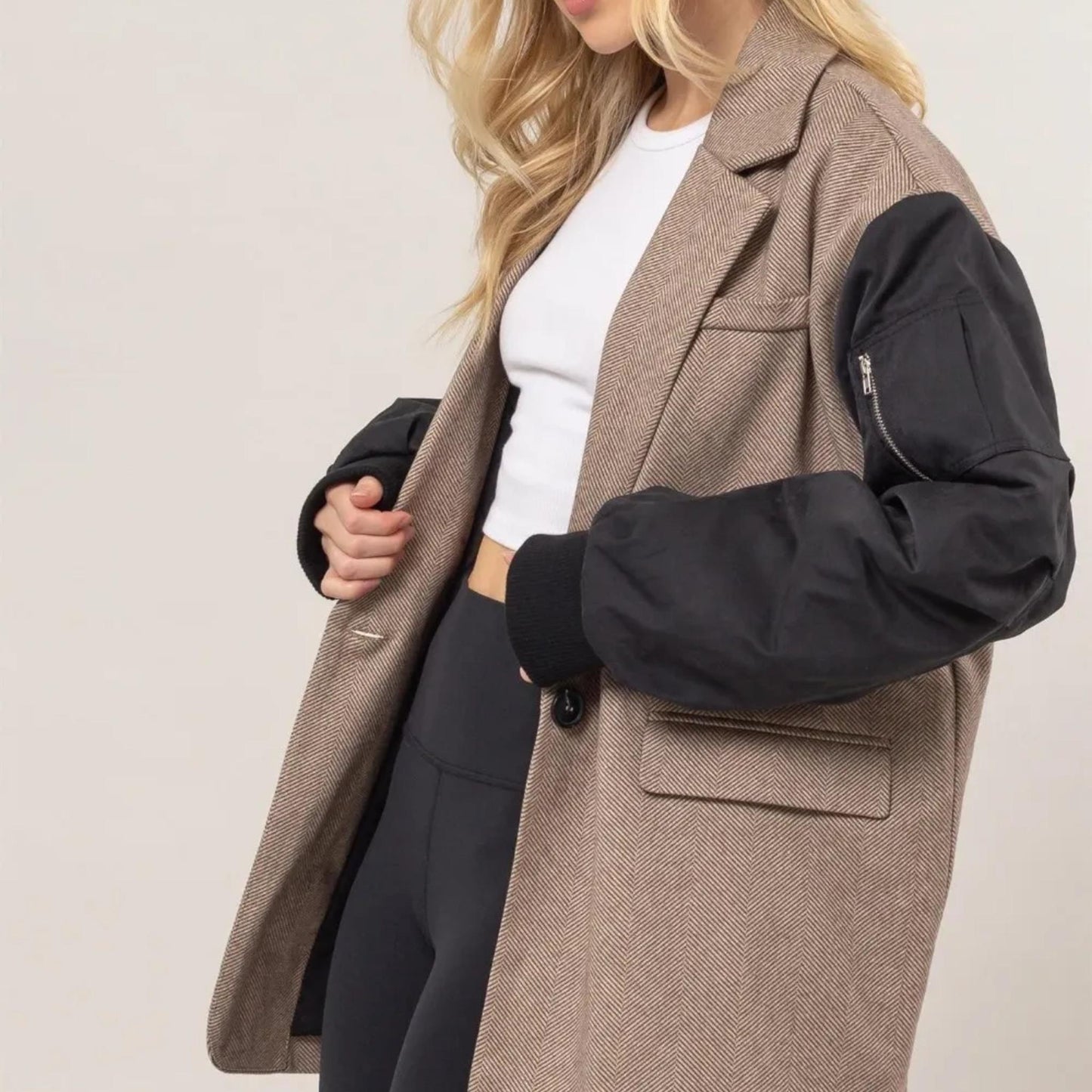 Detail view of the contrast long sleeves and cinched cuffs on the HYFVE blazer.