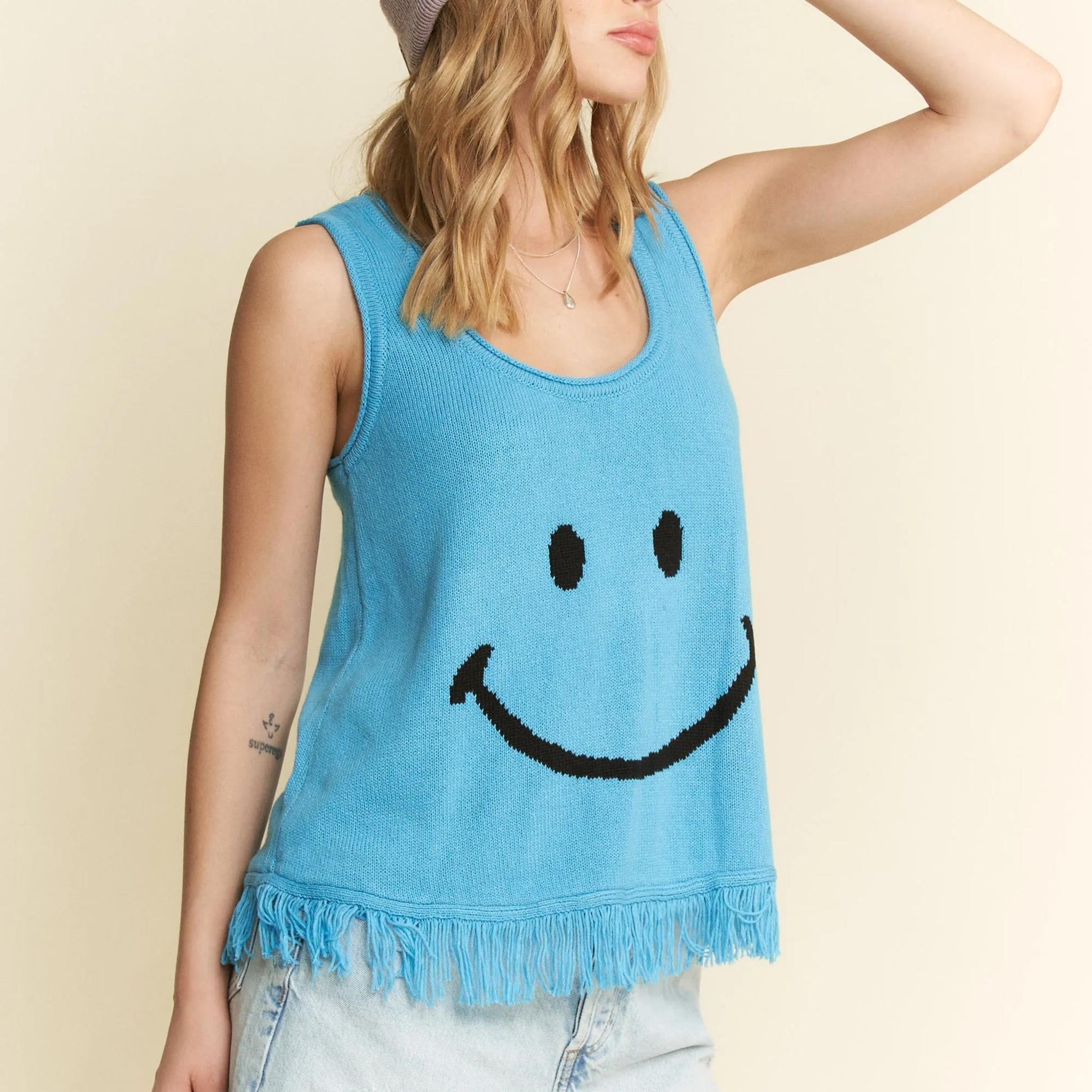 Final model view of the Jade By Jane turquoise sleeveless fringe top.