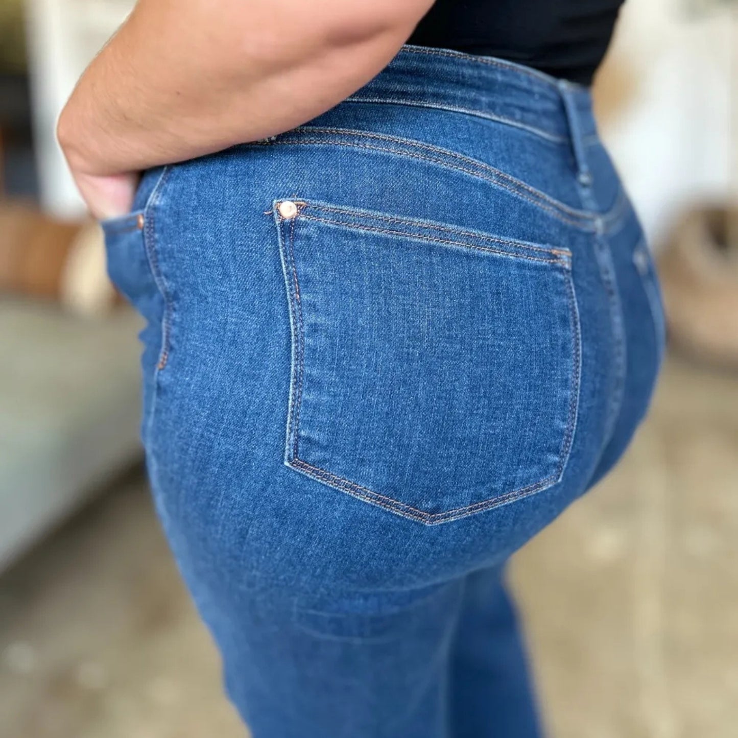 Alternative angle of the high-rise straight-leg jeans on model.