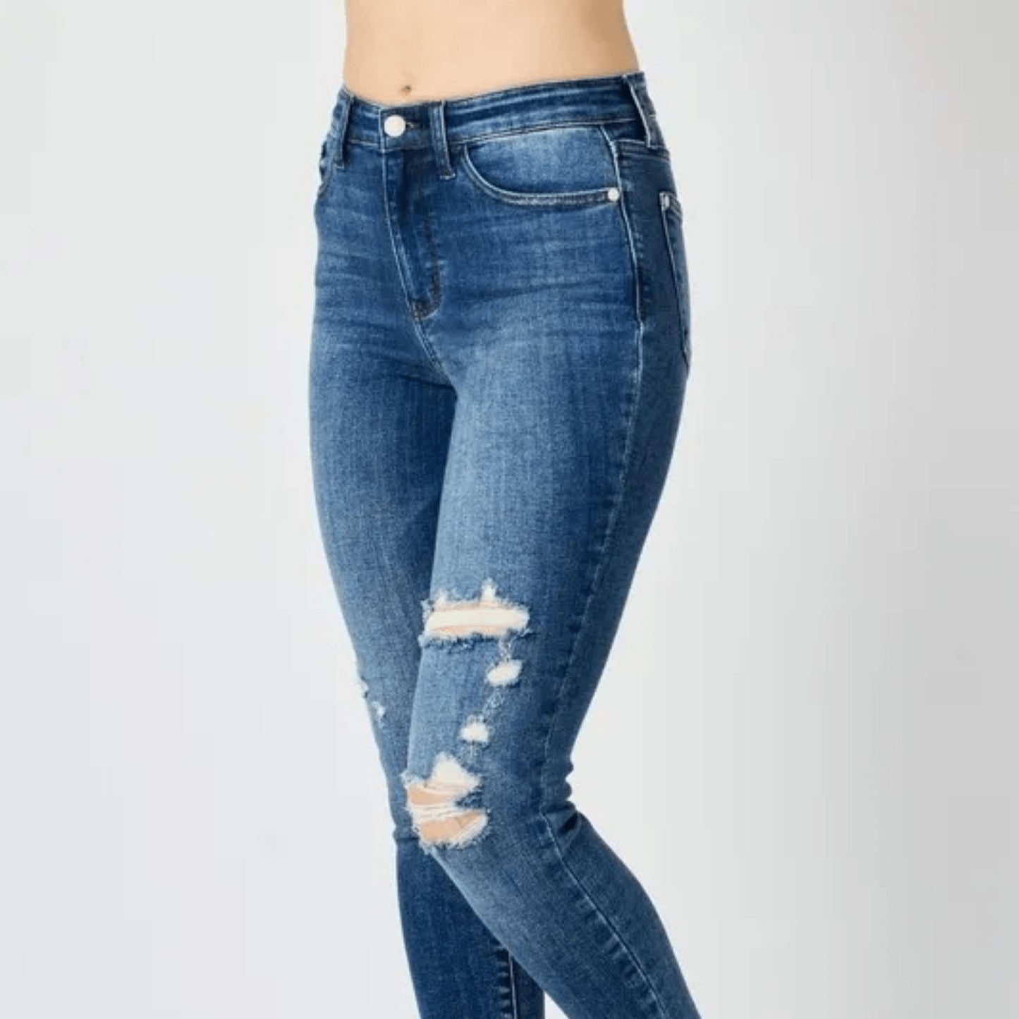 Model wearing Judy Blue high-waist distressed skinny jeans.
