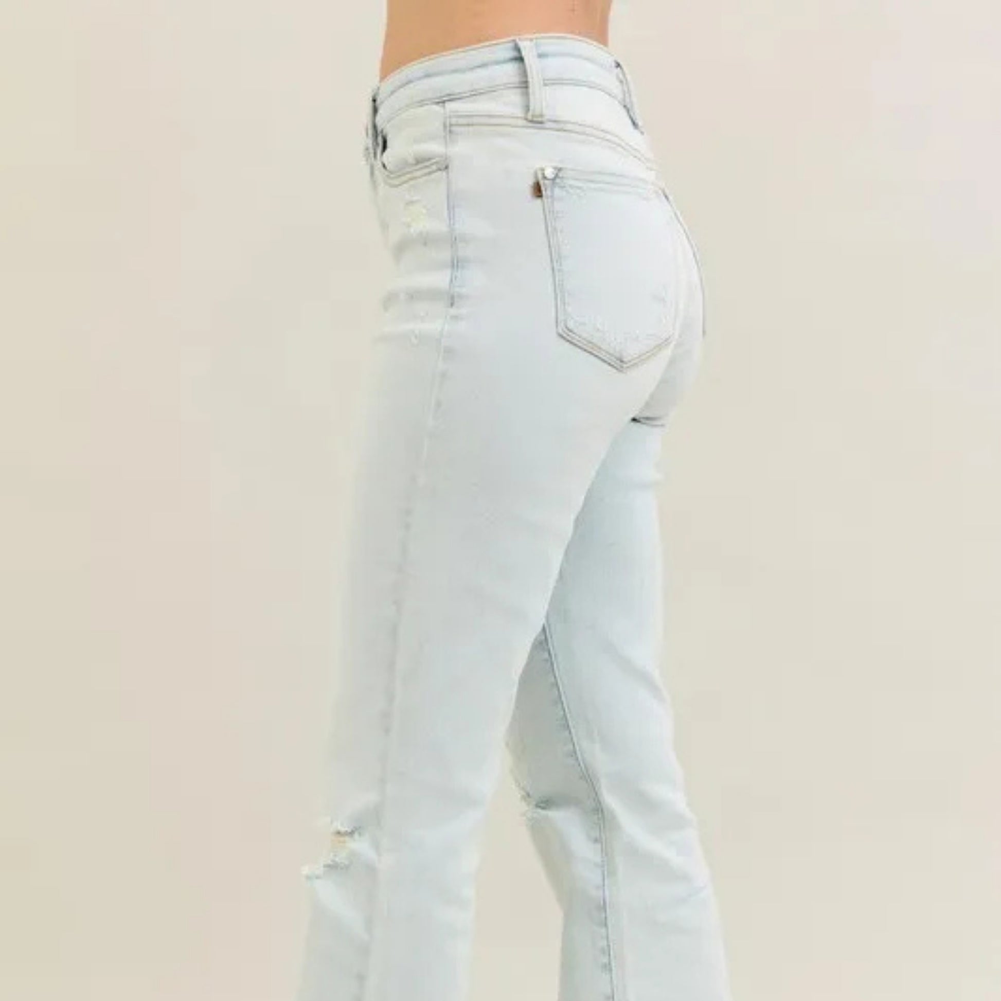Close-up of the raw frayed hem on Judy Blue bootcut jeans.